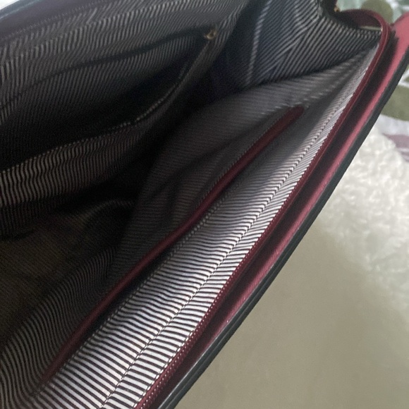 Gently used burgundy colored handbag with gold accents - Picture 4 of 6